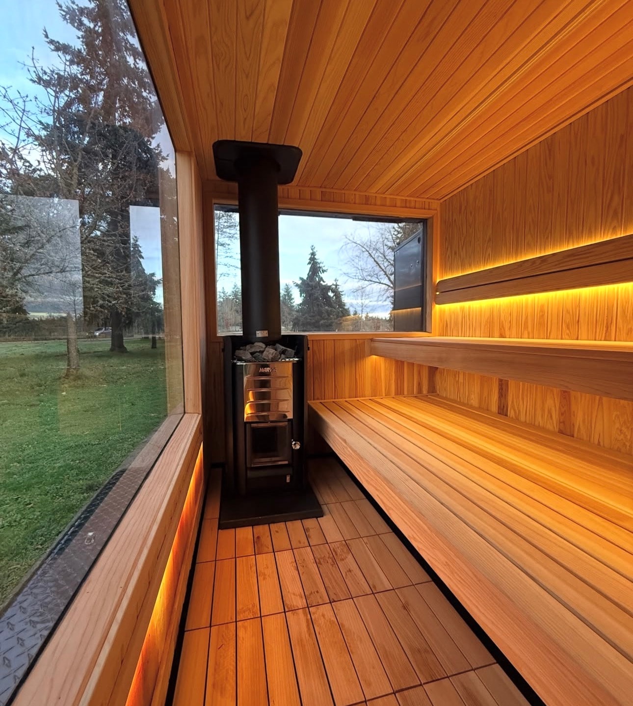 Wood-burning sauna interior with glowing stove